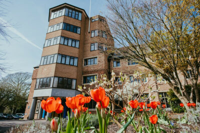 Okinaga Tower with red tulips