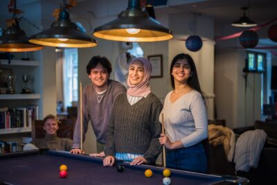 Students in CR playing pool