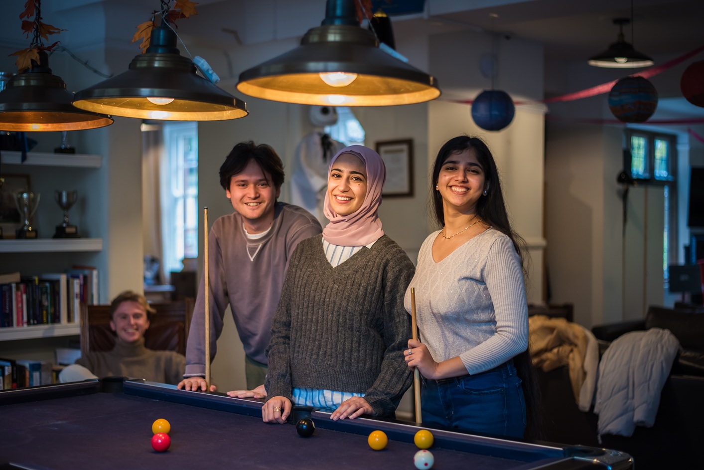 Students in CR playing pool