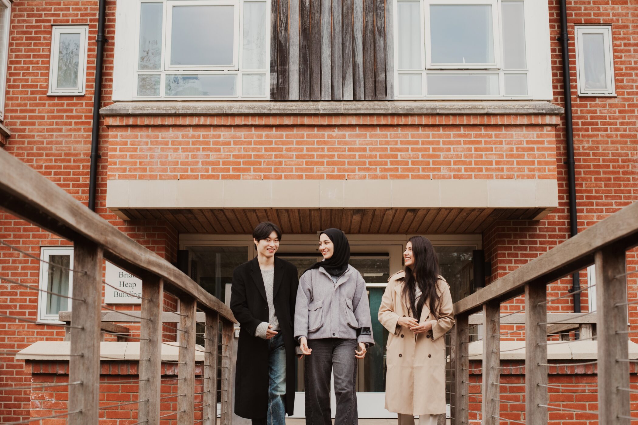 Students walking across bridge