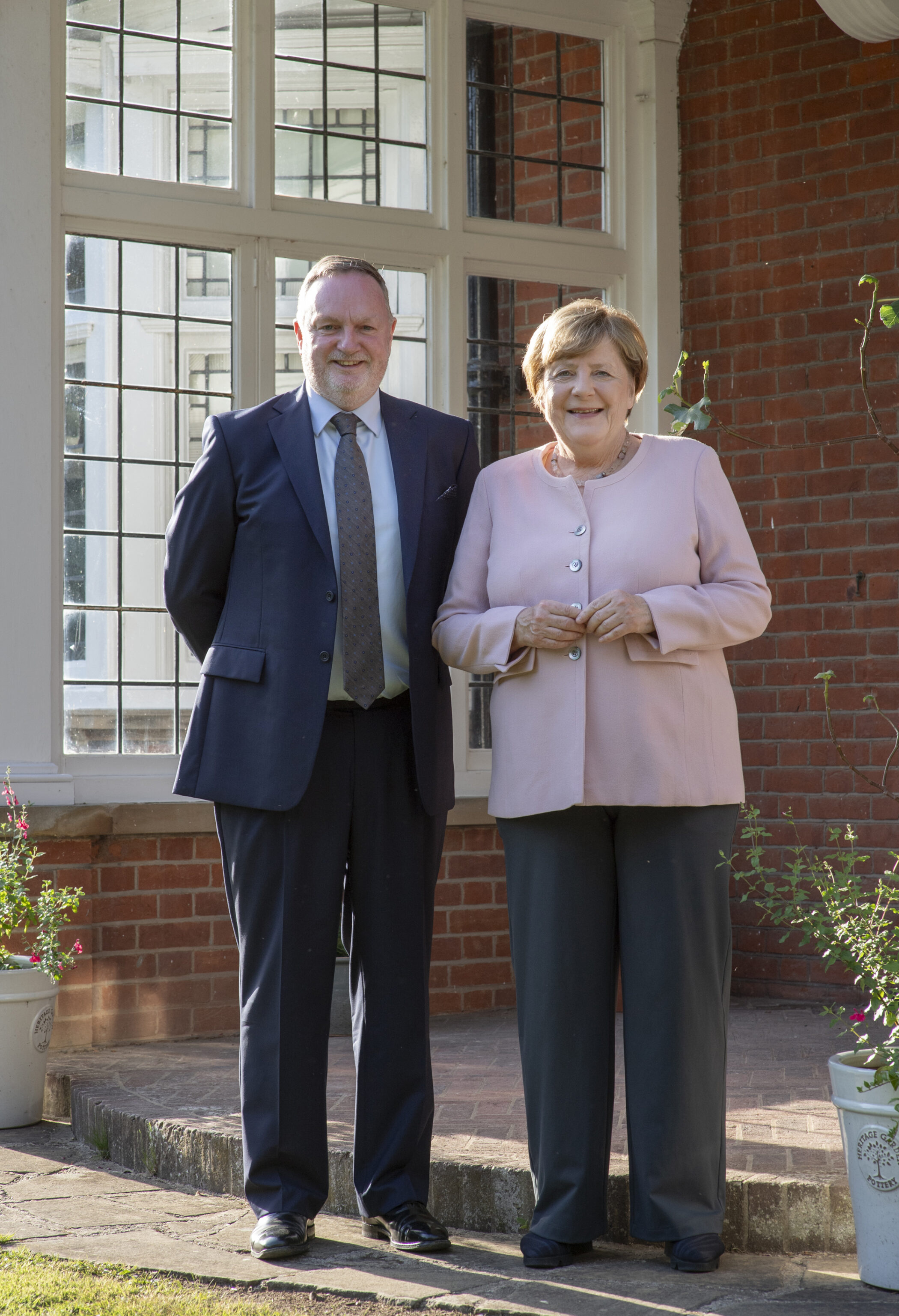 Credit: Nic Marchant - Prof Young and Dr Angela Merkel