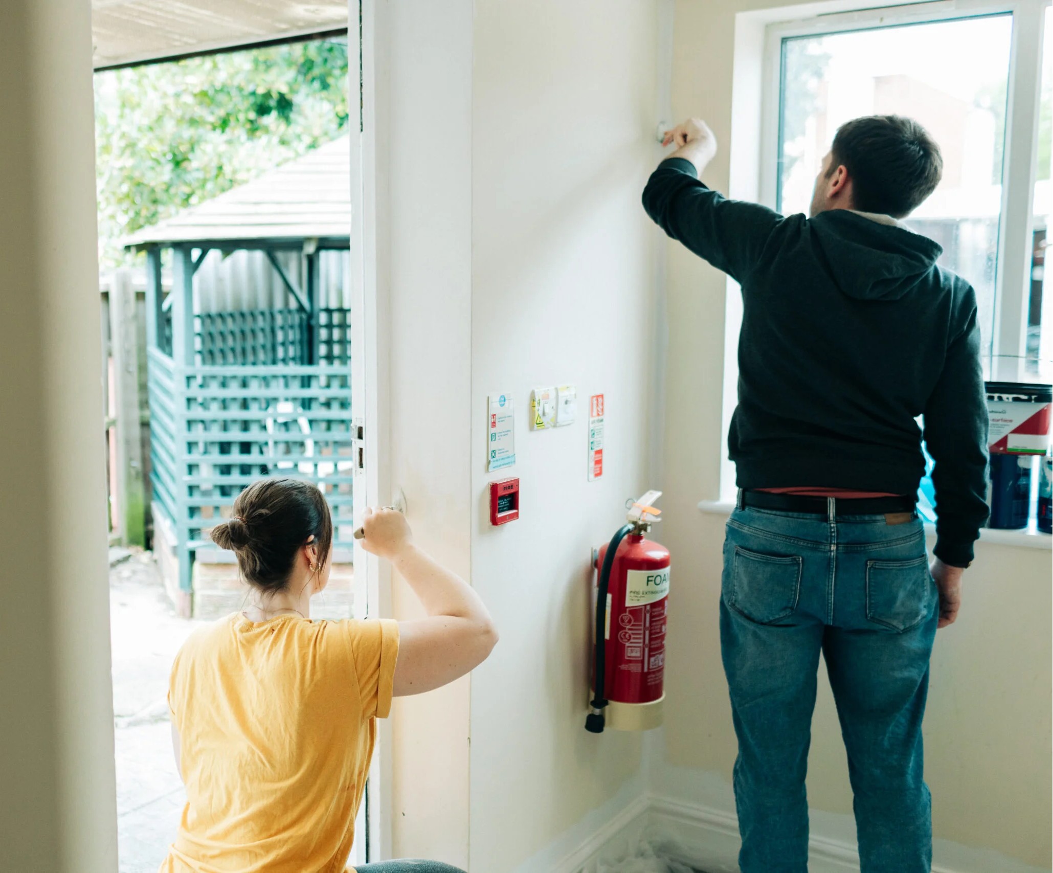 Corporate volunteers redecorating Crossways Accommodation. Credit: It Takes A City