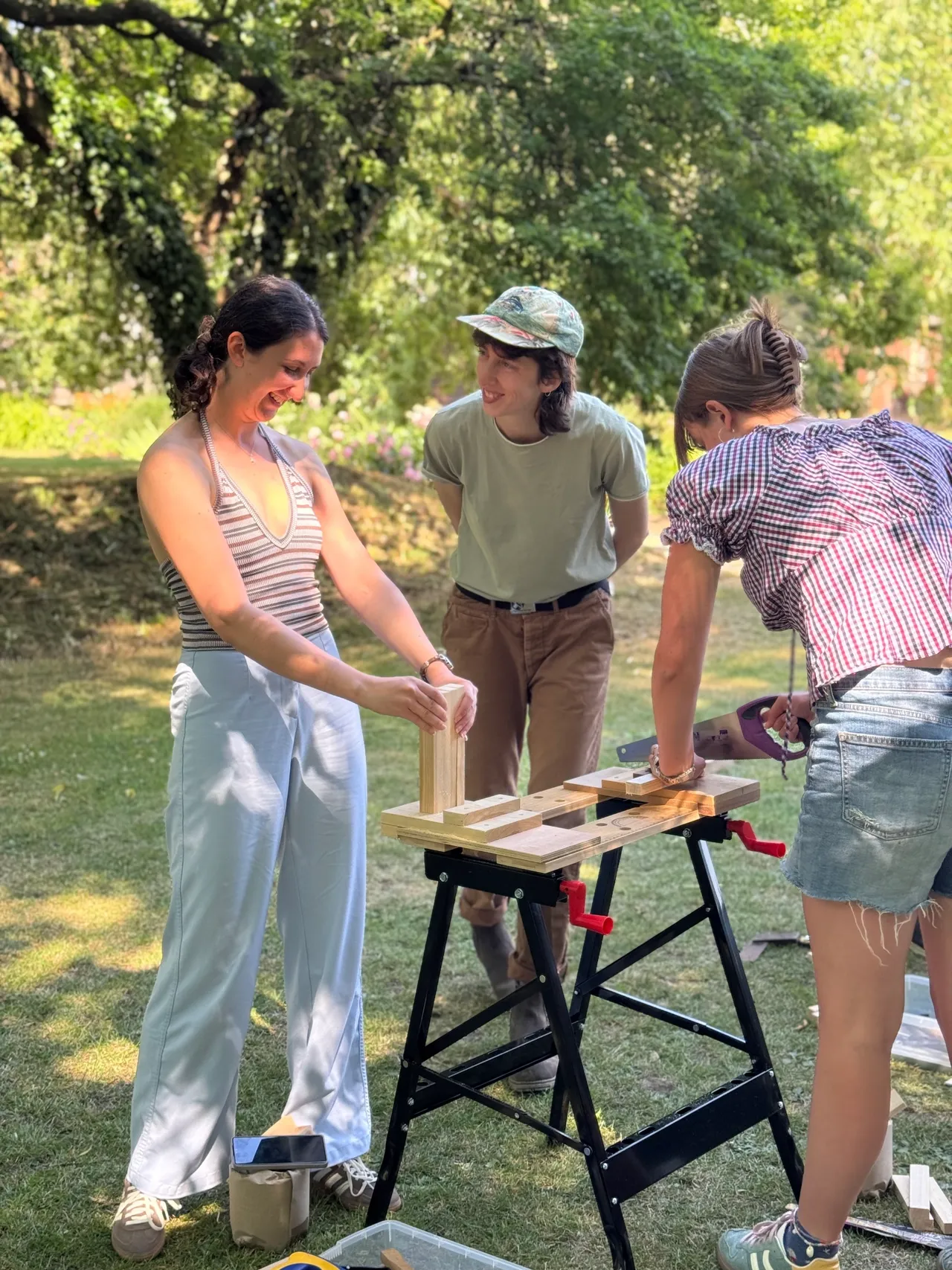 Students doing a carpentry workshop with Wood Woman