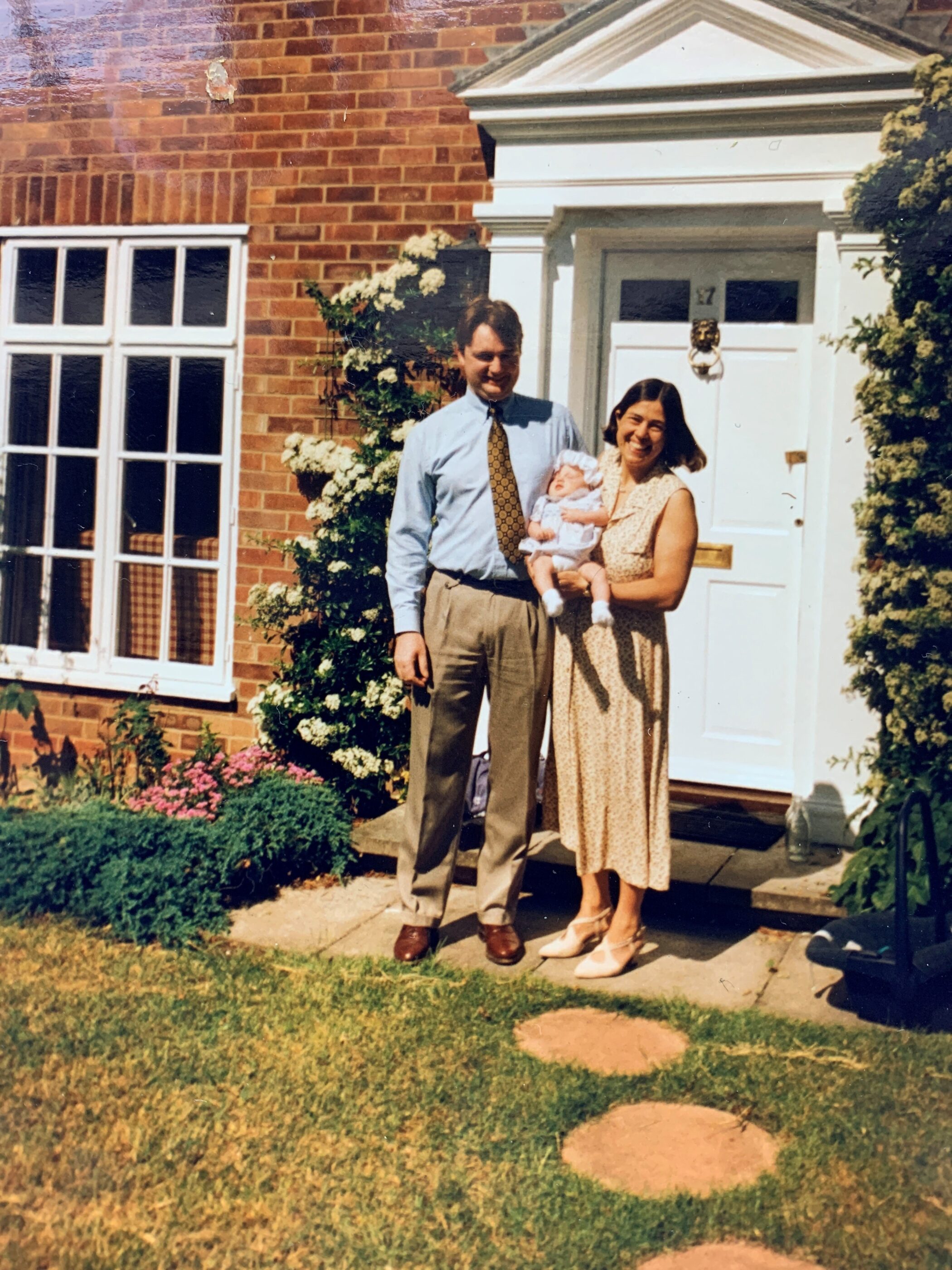 image of family outside house