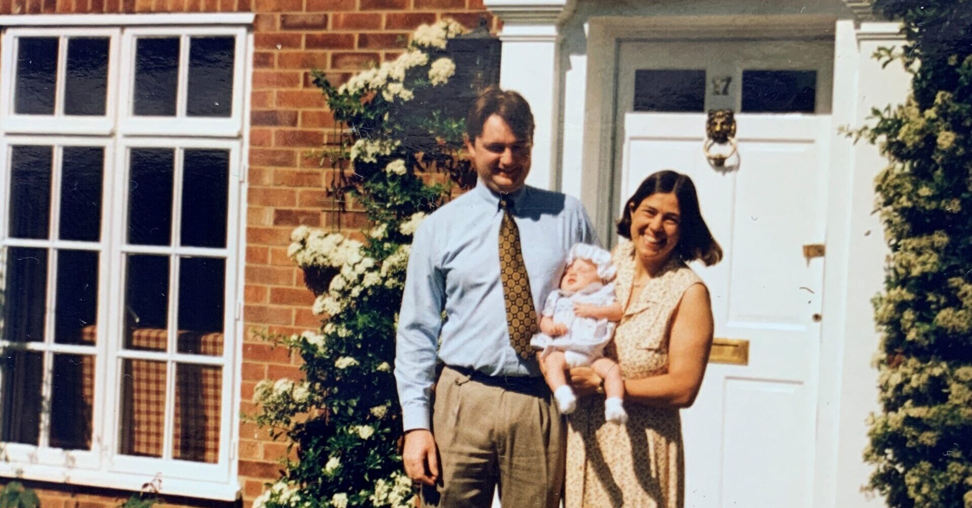 image of family outside house